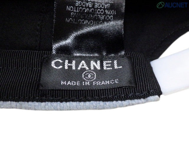 CURATED by Kira Chanel denim hat interior label showing brand logo and cotton material details