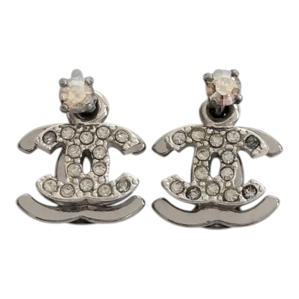 CURATED by Kira silver Chanel Coco earrings featuring sparkling rhinestones in the iconic CC logo design
