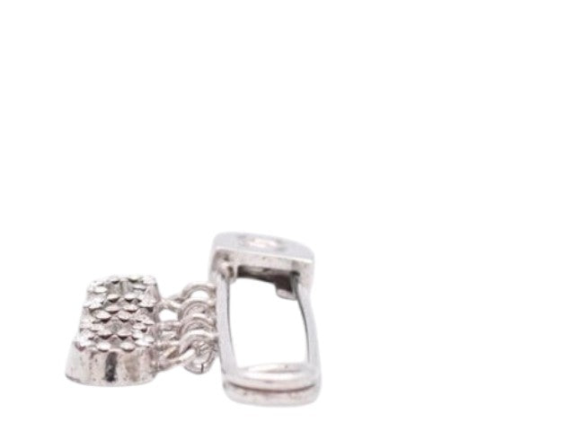 CURATED by Kira Chanel Icon Series silver brooch featuring a safety pin design with dangling metallic charms