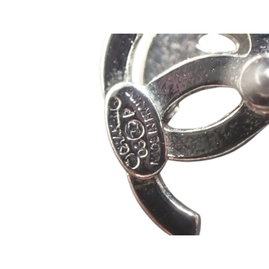 CURATED by Kira Chanel Coco rhinestone silver earring hallmark detail showing authenticity stamp