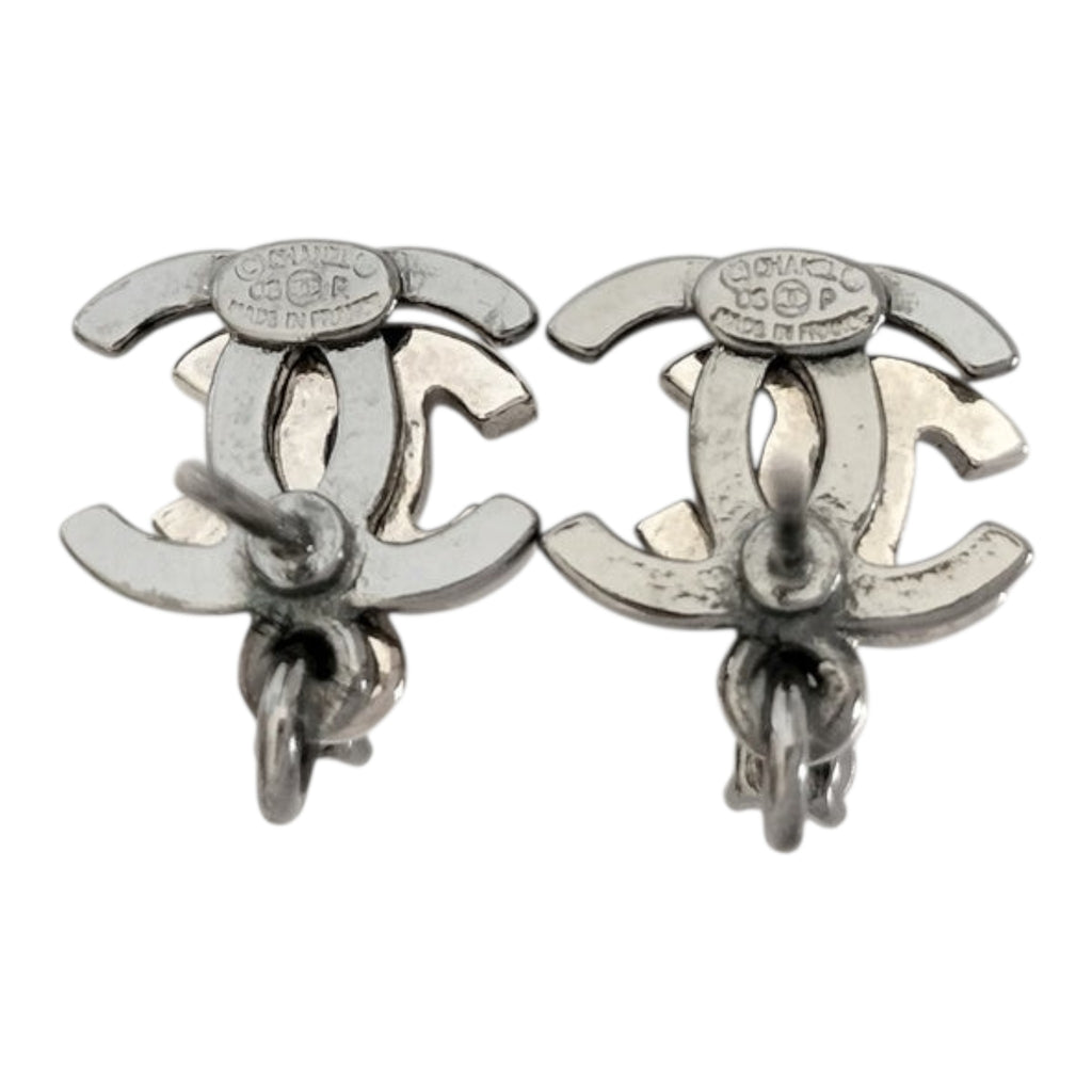 CURATED by Kira Chanel Coco rhinestone silver earrings showing the back side with engraved brand hallmarks