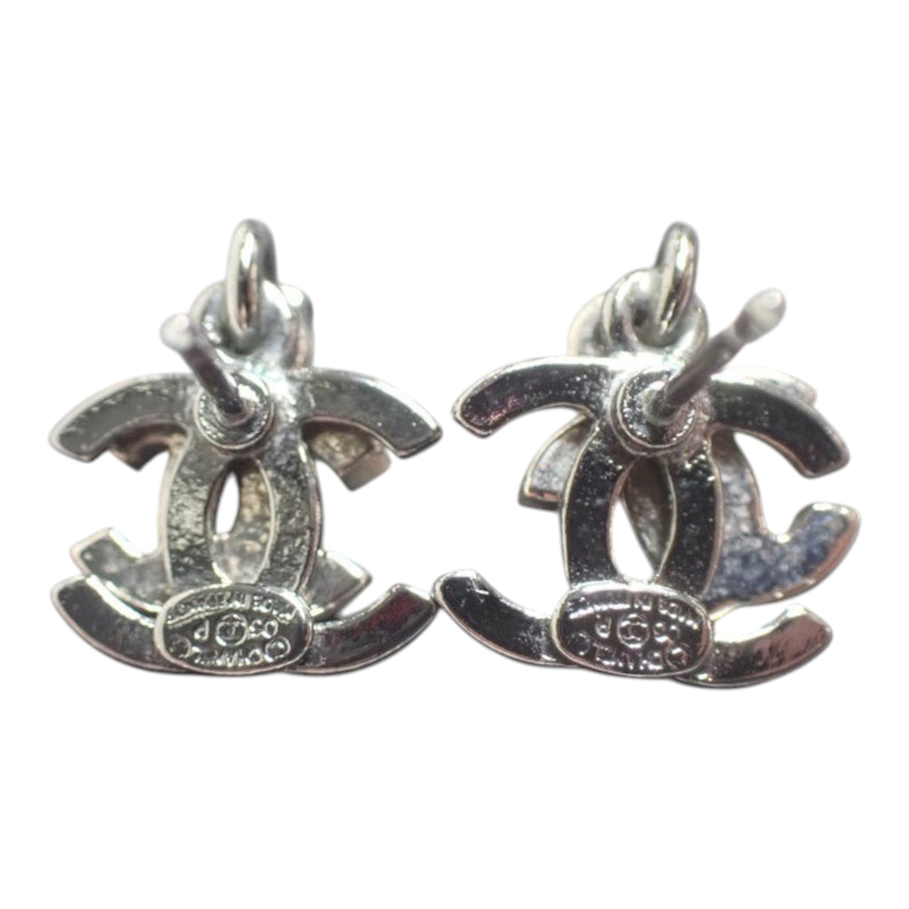 CURATED by Kira Chanel Coco silver stud earrings with rhinestone detailing and iconic CC logo design