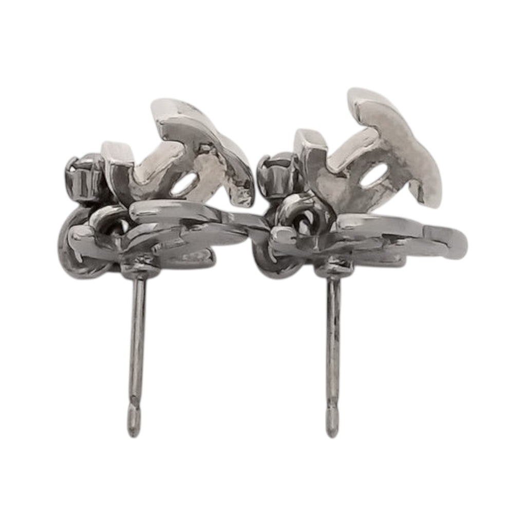 CURATED by Kira Chanel Coco silver stud earrings featuring sparkling rhinestones in a classic logo design