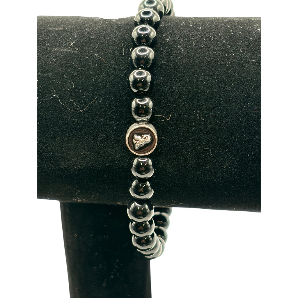 CURATED by Kira Coach men's stretch bracelet featuring black onyx beads and a sterling silver signature logo charm.