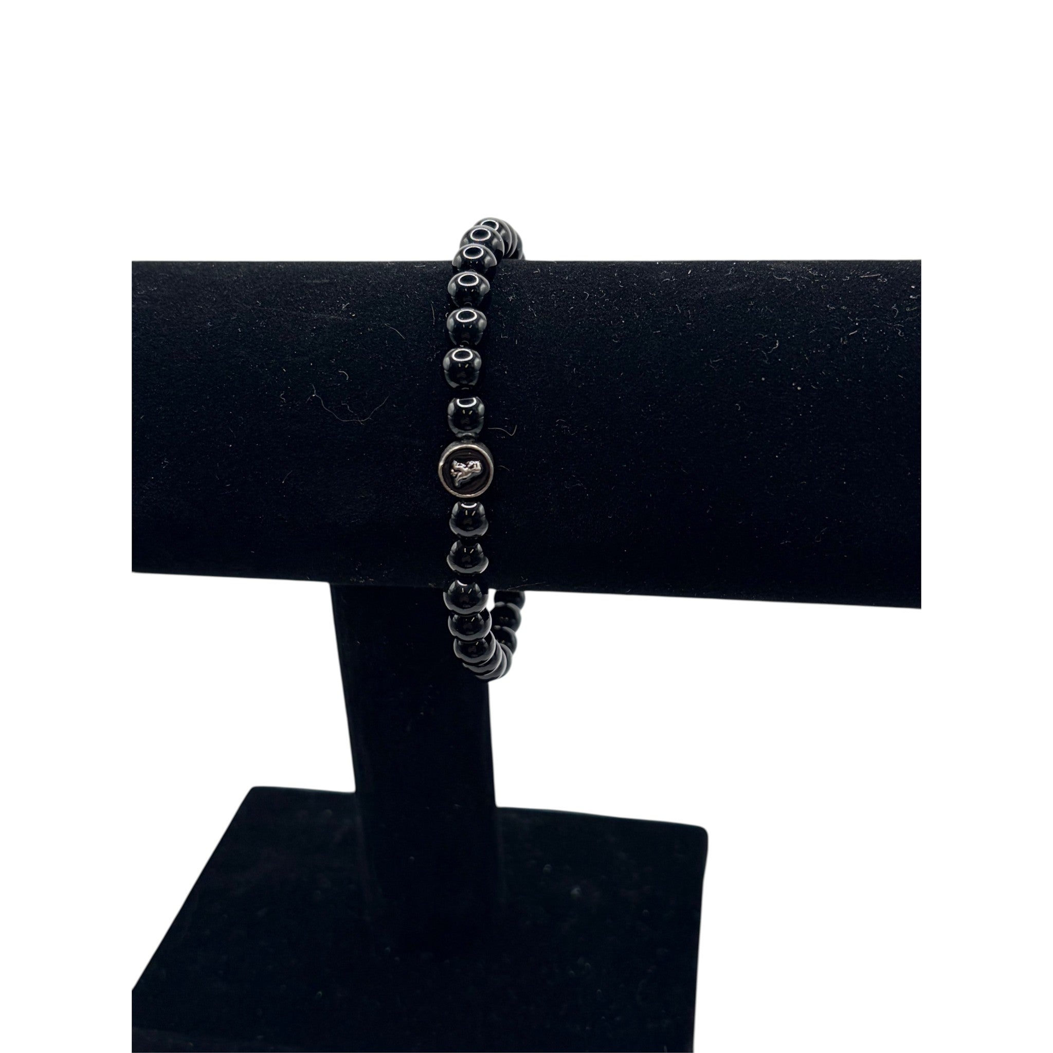 CURATED by Kira Coach men's stretch bracelet featuring black onyx beads and a sterling silver signature logo charm.
