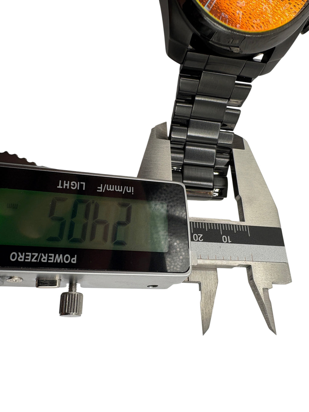 CURATED by Kira Diesel Mega Chief black ion-plated stainless steel watch bracelet being measured with digital calipers
