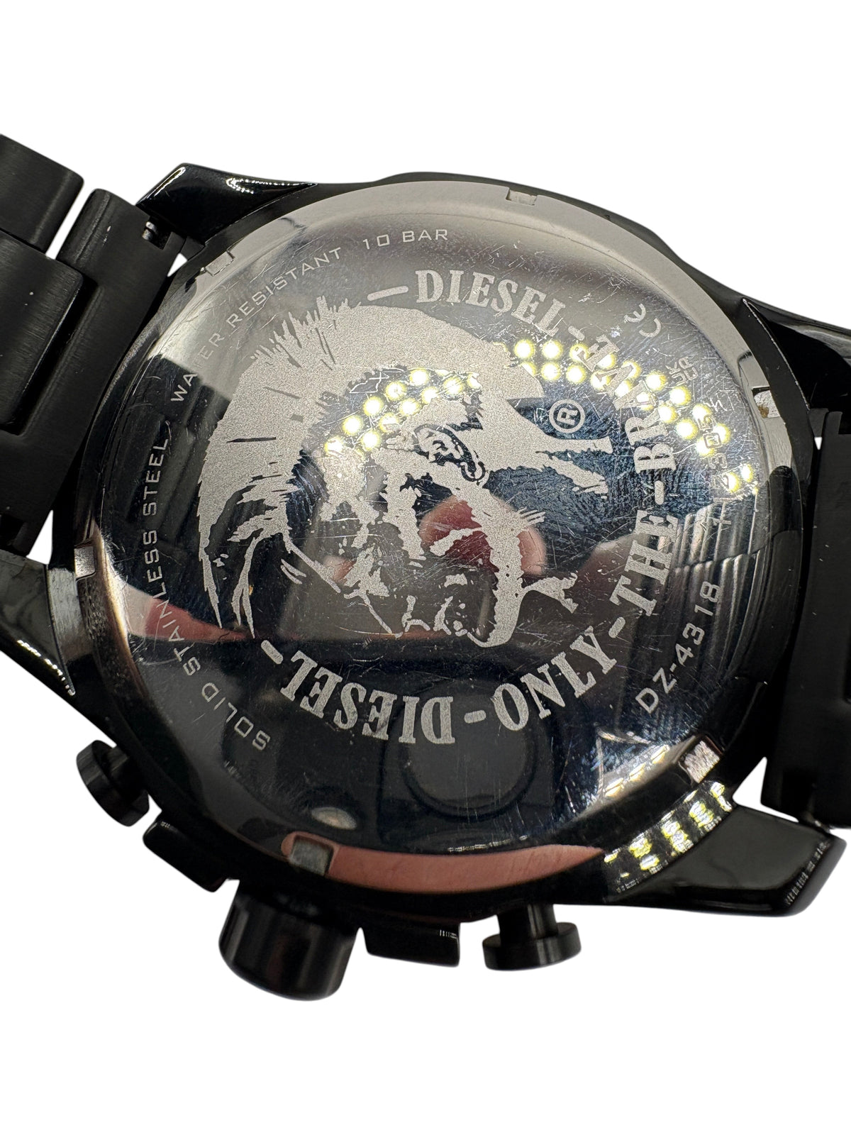 CURATED by Kira Diesel Mega Chief watch case back featuring the iconic Mohawk logo and stainless steel construction.