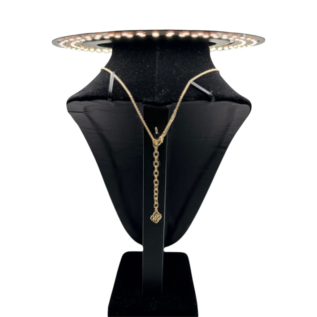 CURATED by Kira Kendra Scott style Elisa pendant necklace featuring a gold chain and red orange stone on a display