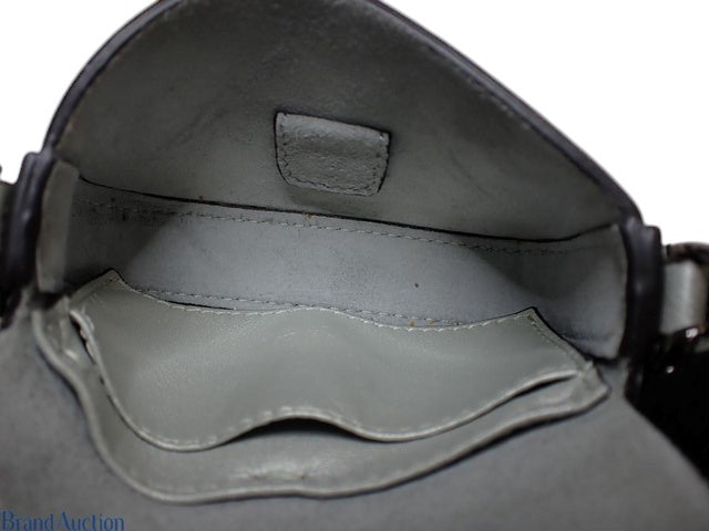 Interior view of a blue Fendi Nano Baguette bag featuring a smooth leather lining from CURATED by Kira