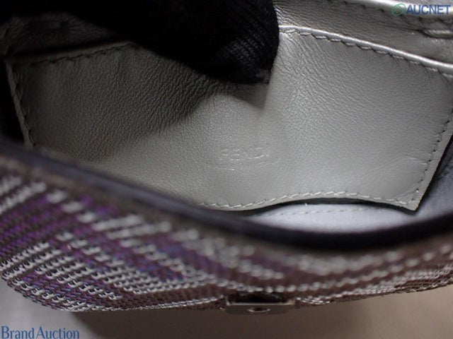 CURATED by Kira Fendi Nano Baguette bag interior showing the embossed logo on blue leather lining