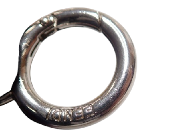 CURATED by Kira Fendi purple pom pom keychain charm featuring a silver-tone metal ring with engraved logo branding