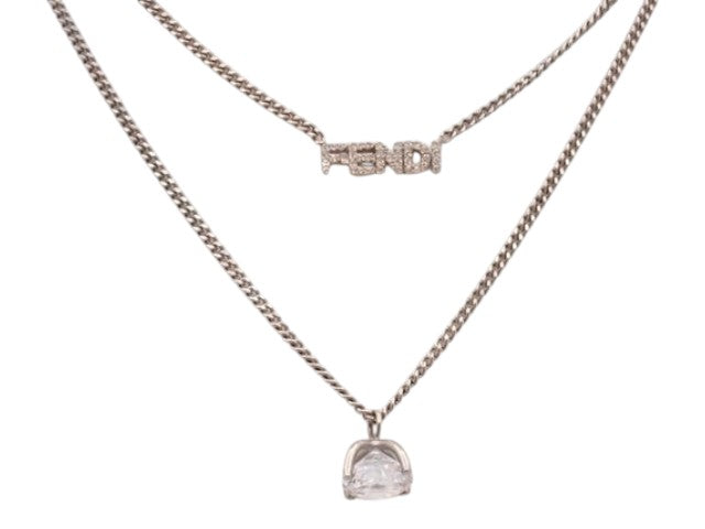 CURATED by Kira Fendi silver necklace featuring a crystal-embellished Fendi logo pendant and a solitaire charm