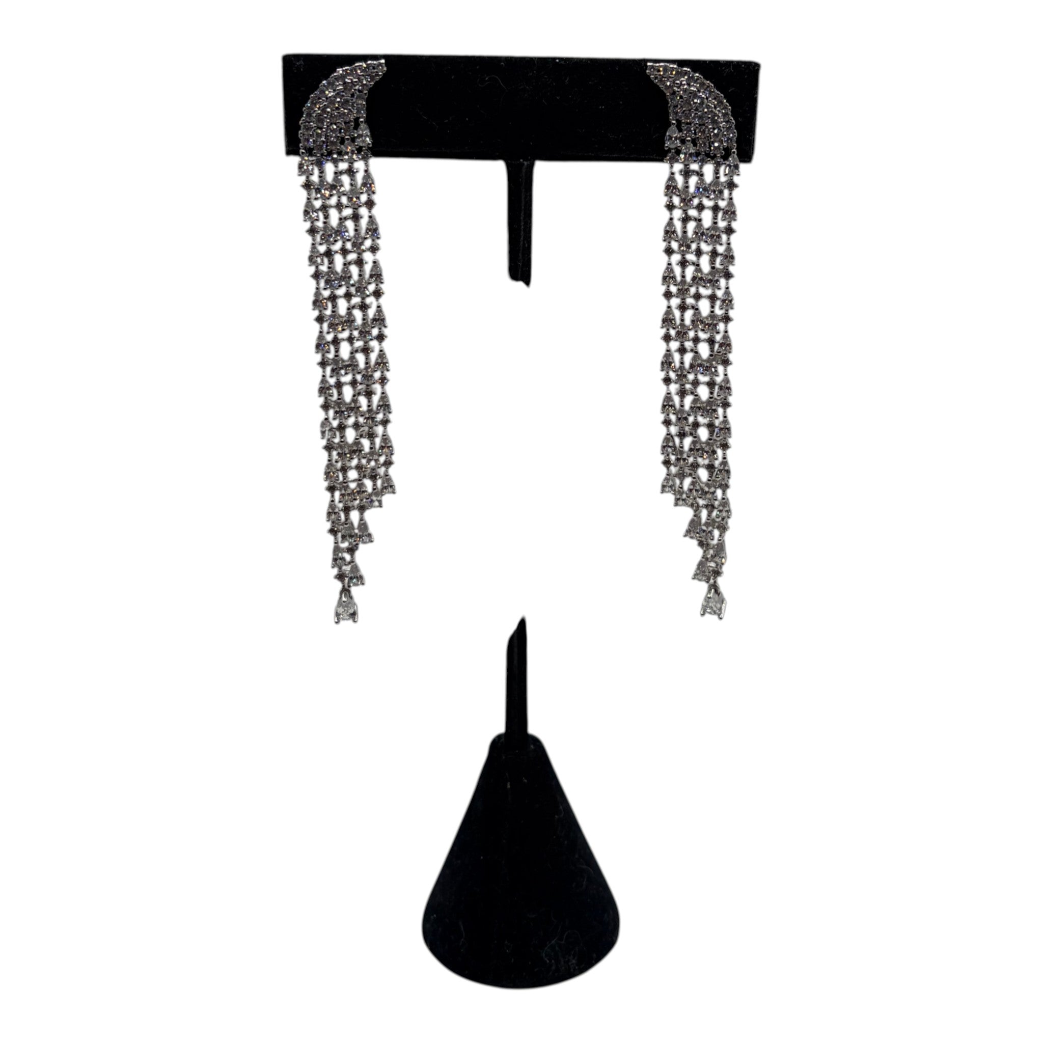 CURATED by Kira Genevive La Scène silver waterfall dangle earrings with sparkling crystal accents on a display stand
