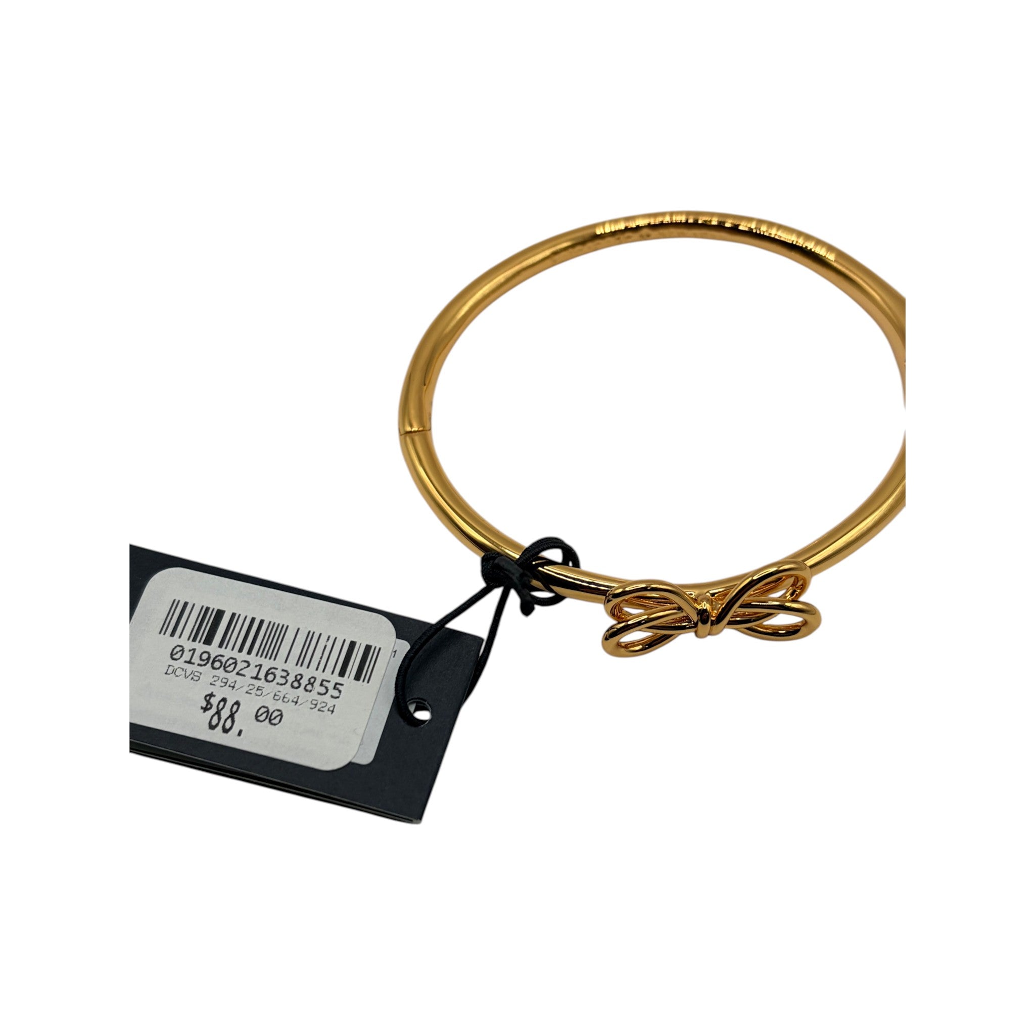 CURATED by Kira gold tone Kate Spade New York hinged bangle bracelet featuring a delicate bow knot detail