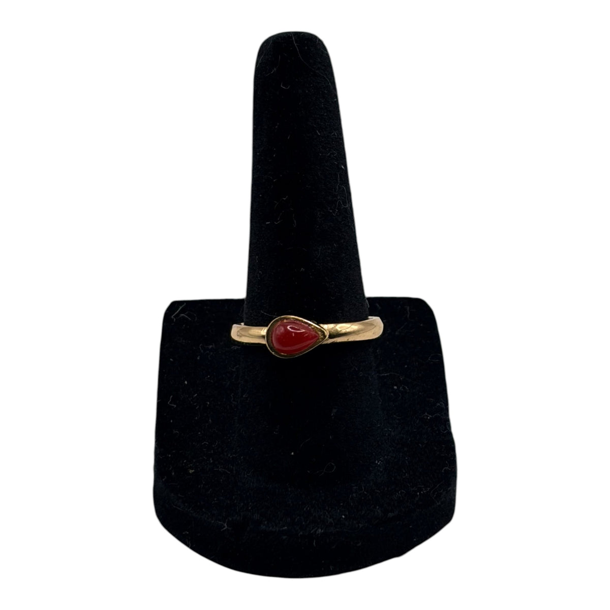 CURATED by Kira gold tone ring featuring a teardrop shaped carnelian cabochon stone on a simple band