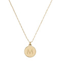 CURATED by Kira gold Kate Spade New York mini pendant necklace featuring a circular charm with the initial M