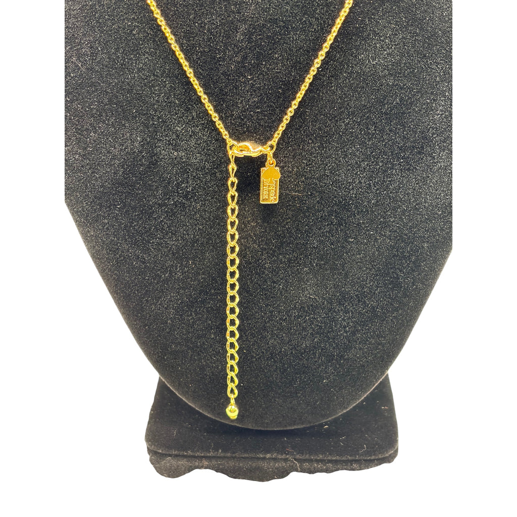 CURATED by Kira gold Kate Spade New York initial M mini pendant necklace on a black display stand