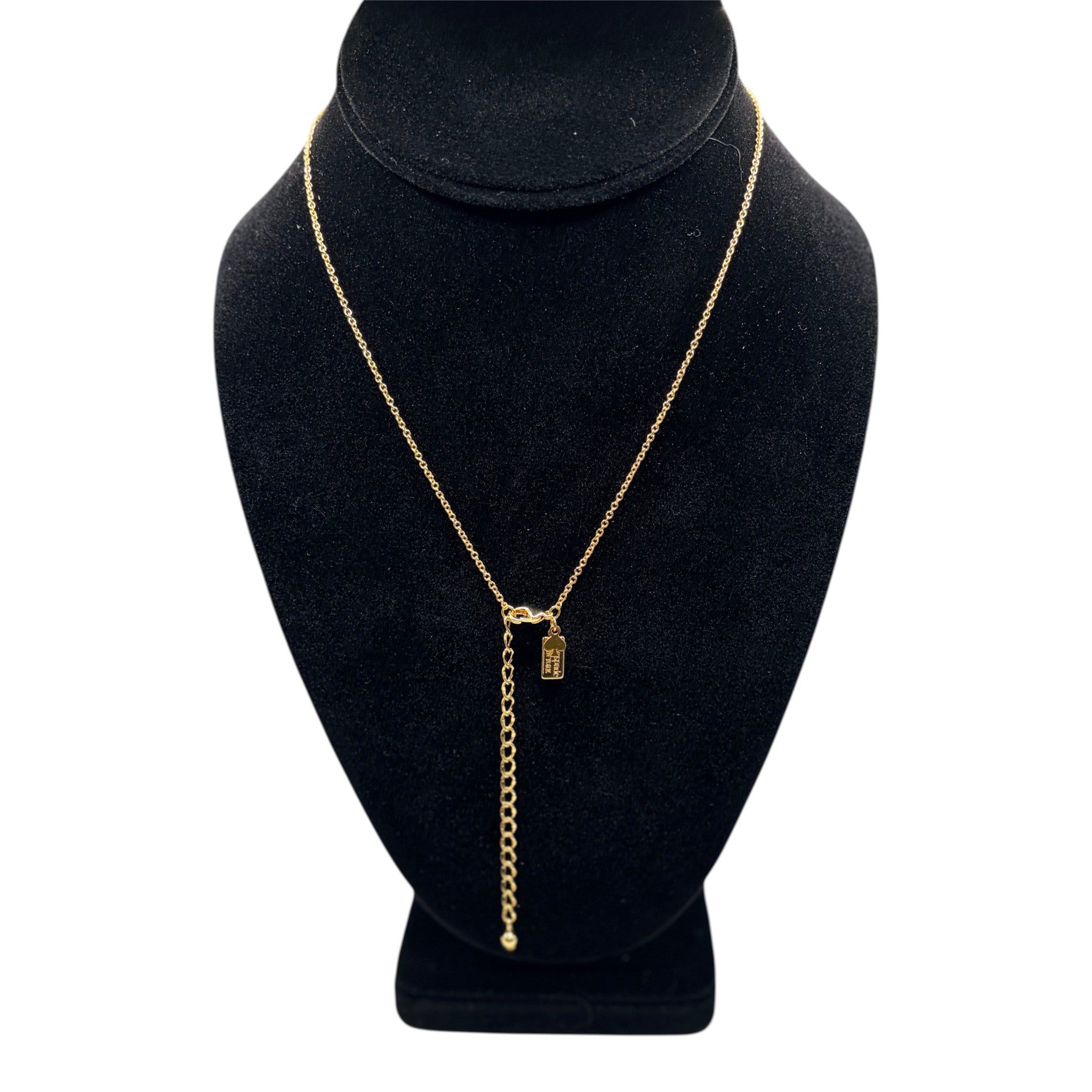 CURATED by Kira gold Kate Spade New York initial M mini pendant necklace on a black velvet display bust