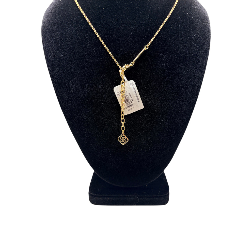 CURATED by Kira gold pendant necklace with delicate chain and adjustable clasp on a black display bust