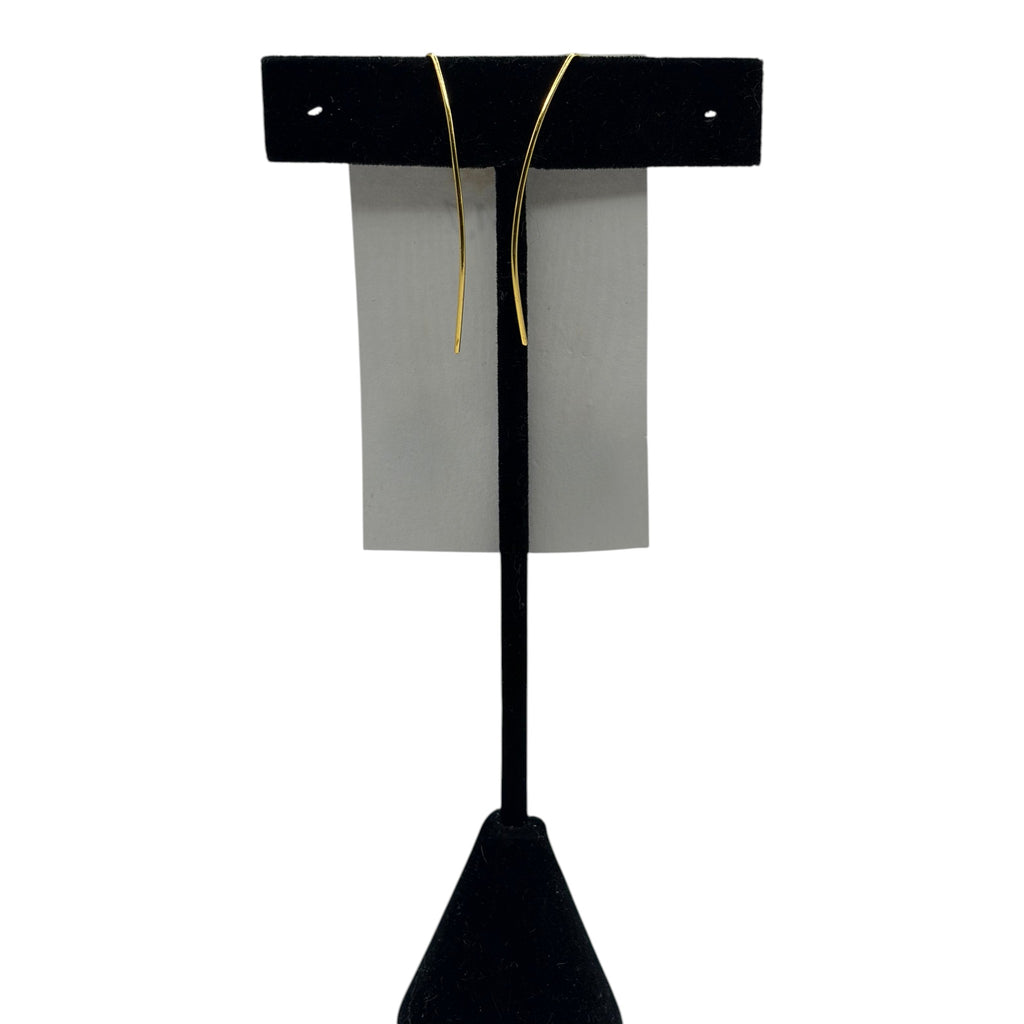 CURATED by Kira MINU Jewels gold tone wire wrap dangle earrings displayed on a black stand