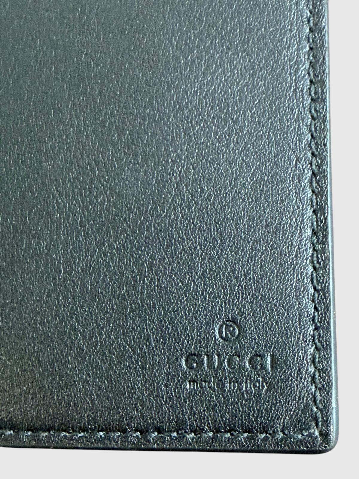 CURATED by Kira Gucci black grainy calfskin card case with embossed GG logo and stitched edge detail