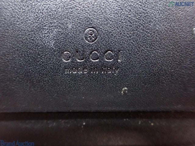 CURATED by Kira Gucci Guccissima black leather bi-fold wallet featuring embossed logo detail