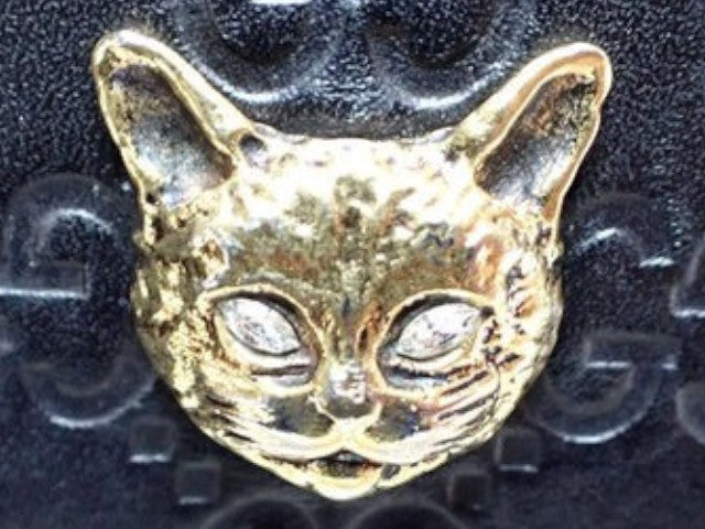 CURATED by Kira Gucci Guccissima bi-fold wallet featuring a gold-tone metal cat head emblem on black leather