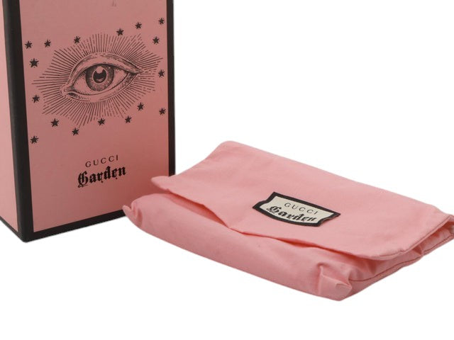 CURATED by Kira Gucci Garden pink dust bag and branded box with eye illustration