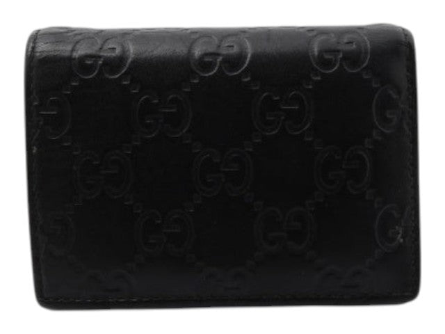 CURATED by Kira black Gucci Guccissima bi-fold wallet featuring embossed GG logo pattern
