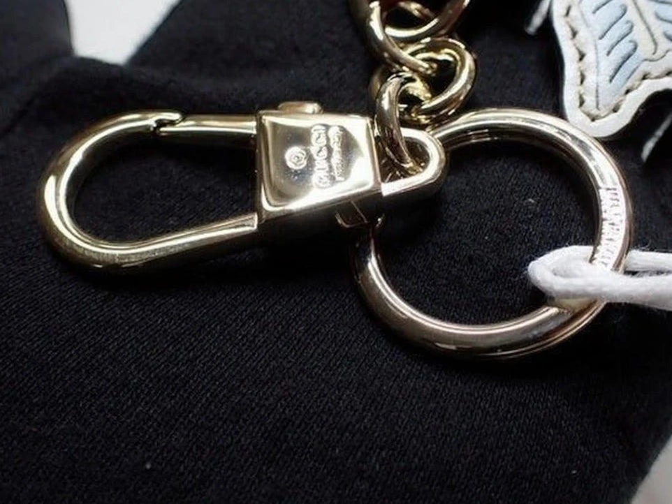 CURATED by Kira Gucci GG heart keyring in pink with gold-tone metal hardware and lobster clasp attachment
