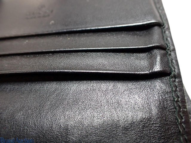 CURATED by Kira black Gucci Guccissima leather bi-fold wallet interior card slots detail