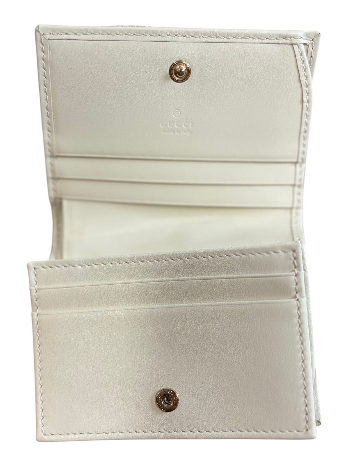 CURATED by Kira Gucci GG Marmont wallet interior featuring white leather lining, card slots, and gold-tone hardware.