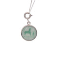 CURATED by Kira Hermes Serie Top charm featuring a green circular pendant with a horse motif in silver setting
