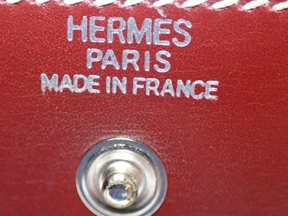 CURATED by Kira Hermes maroon leather notepad interior with silver embossed logo and metal snap button closure