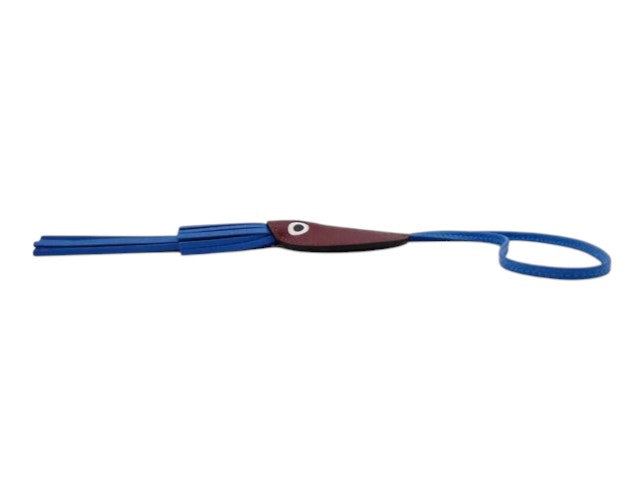 CURATED by Kira Hermes Purupu octopus charm in blue leather with a maroon head and long tassel tentacles