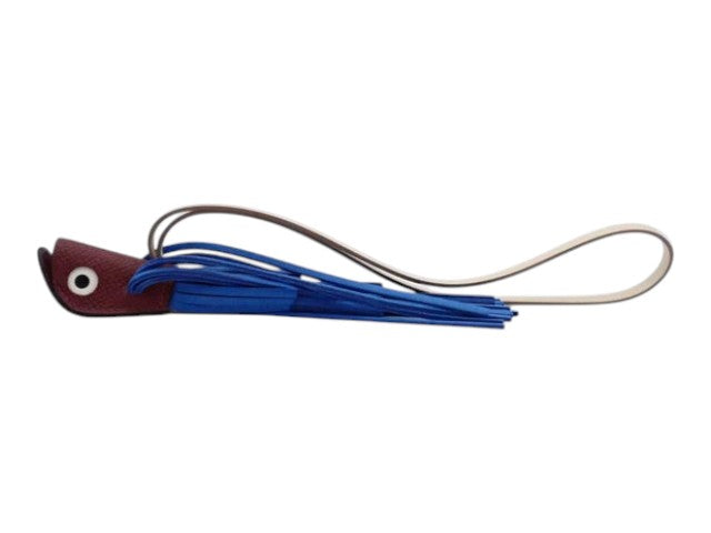 CURATED by Kira Hermes Poisson fish charm in blue leather with a long strap and fringe detail