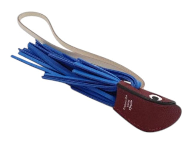 CURATED by Kira Hermes Poisson fish charm in blue and burgundy leather with a long strap