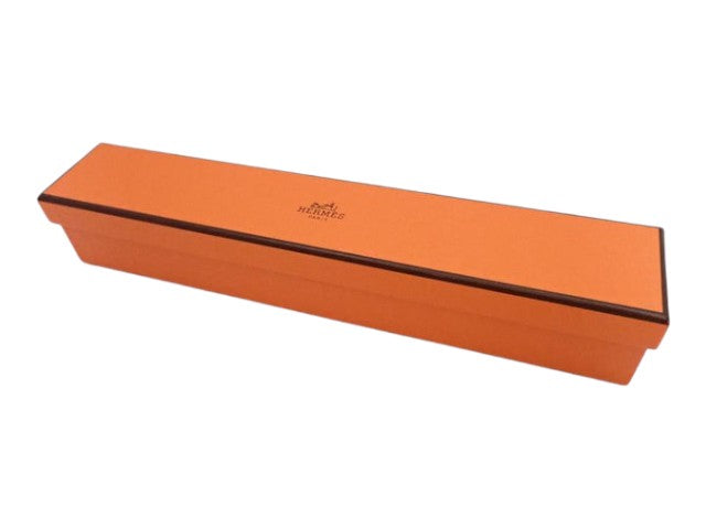 CURATED by Kira Hermes Poisson charm blue accessory presented in its signature orange branded gift box