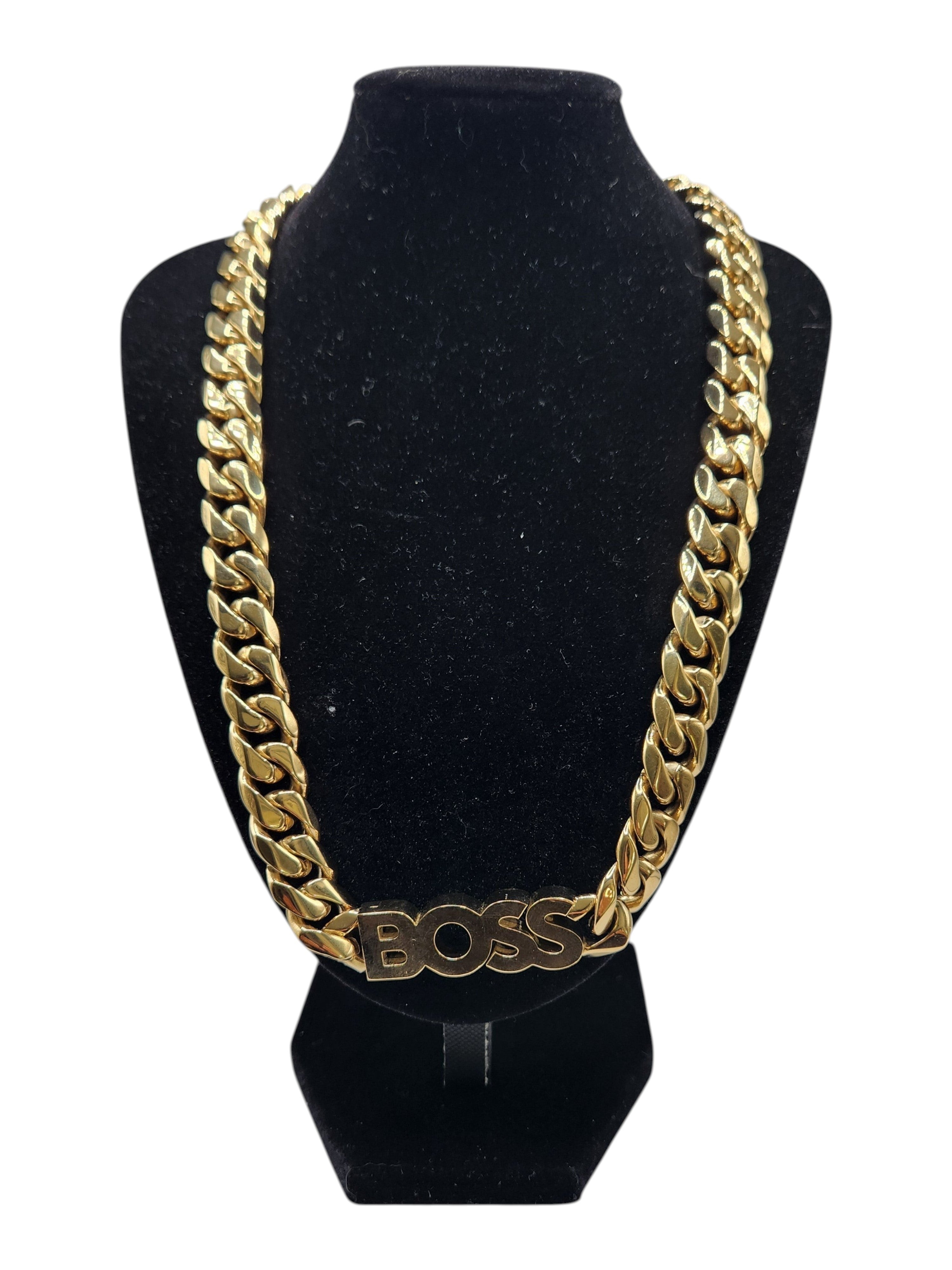 CURATED by Kira Hugo Boss gold-tone stainless steel Cuban link chain necklace with BOSS logo centerpiece on display