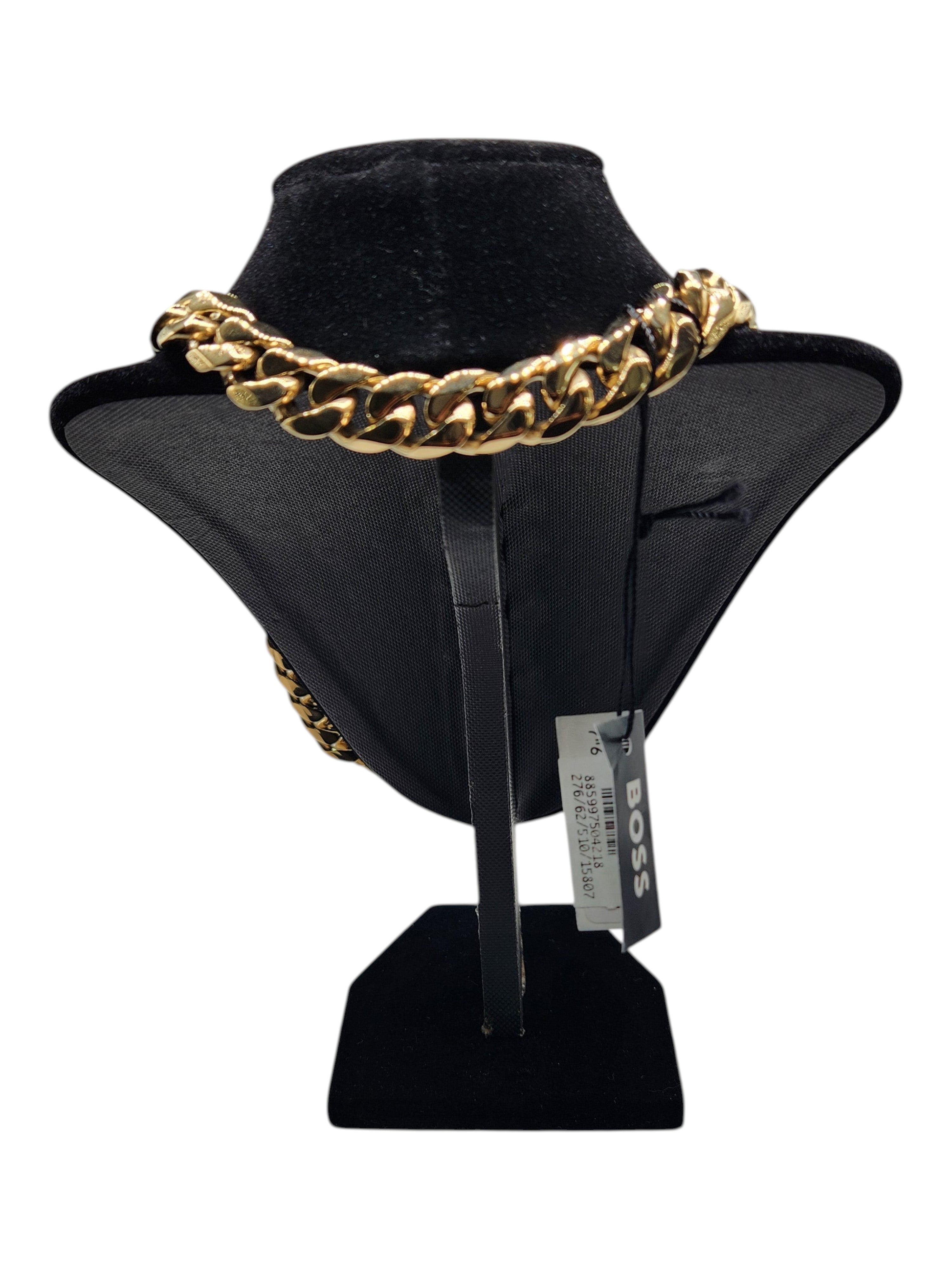 CURATED by Kira Hugo Boss gold-tone stainless steel Cuban link chain necklace on a black display stand