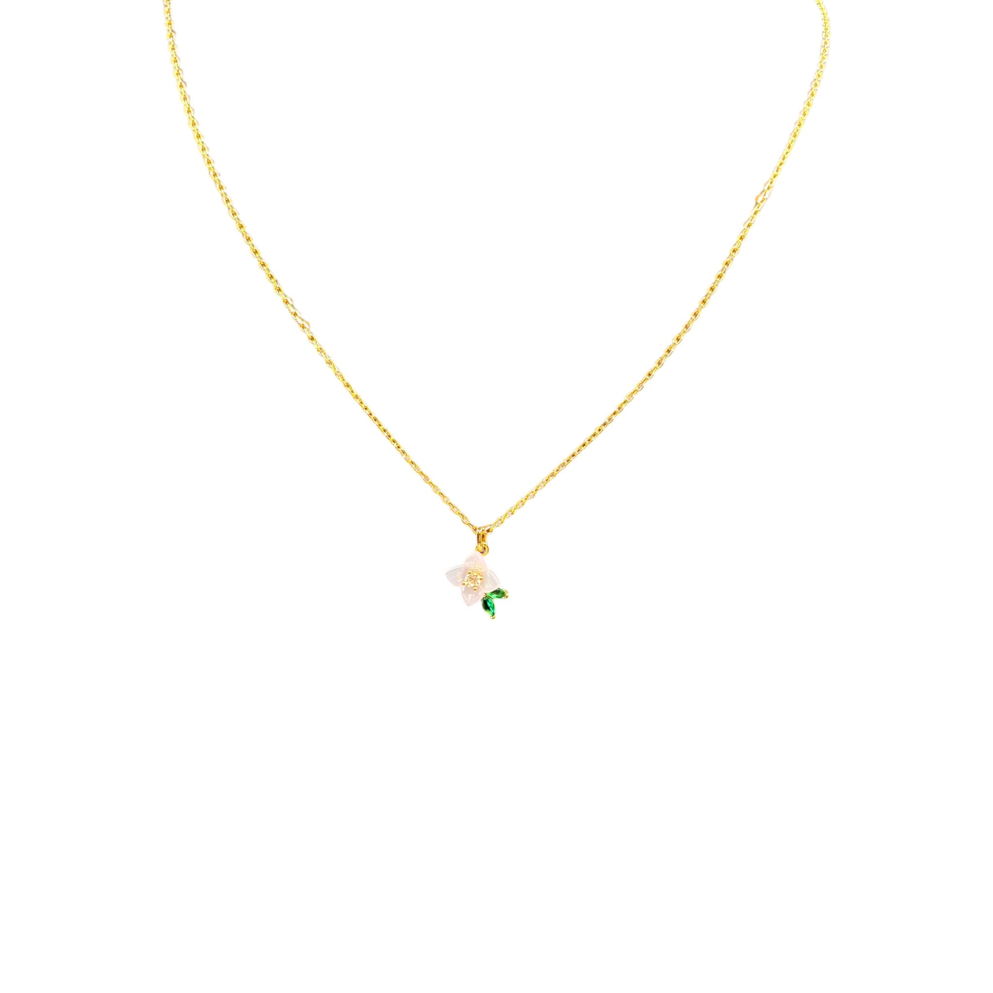 CURATED by Kira Kate Spade pendant necklace featuring a delicate white resin flower with cubic zirconia and green leaf
