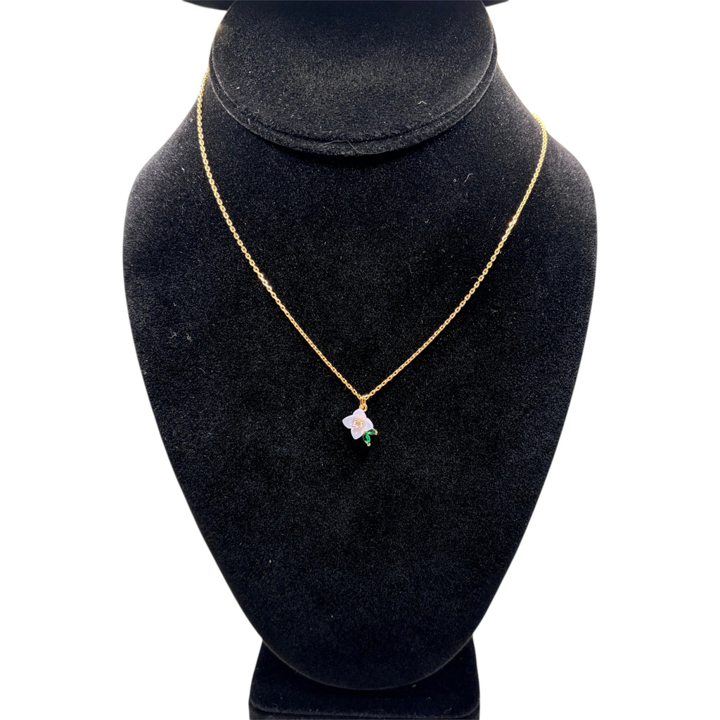 CURATED by Kira Kate Spade pendant necklace featuring a white resin flower with cubic zirconia on a gold chain