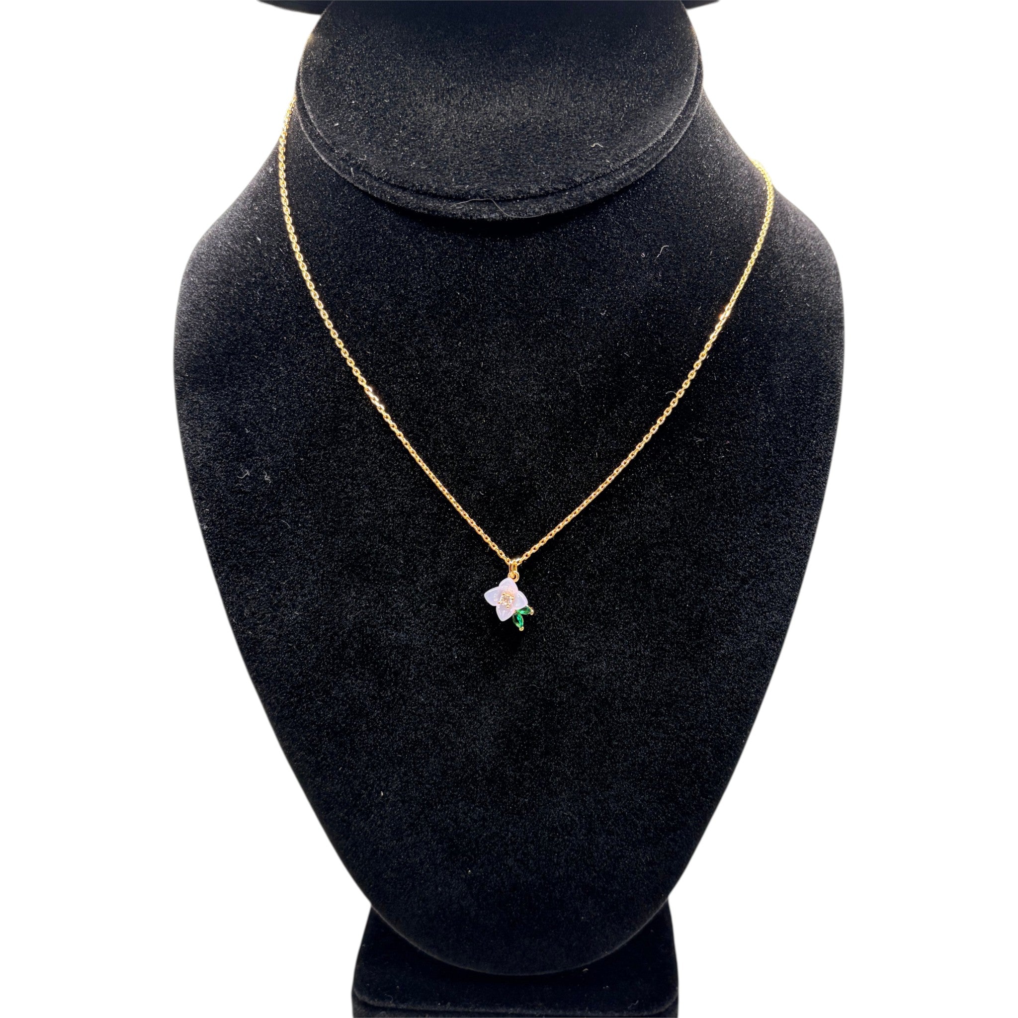 CURATED by Kira Kate Spade pendant necklace featuring a white resin flower with cubic zirconia on a gold chain