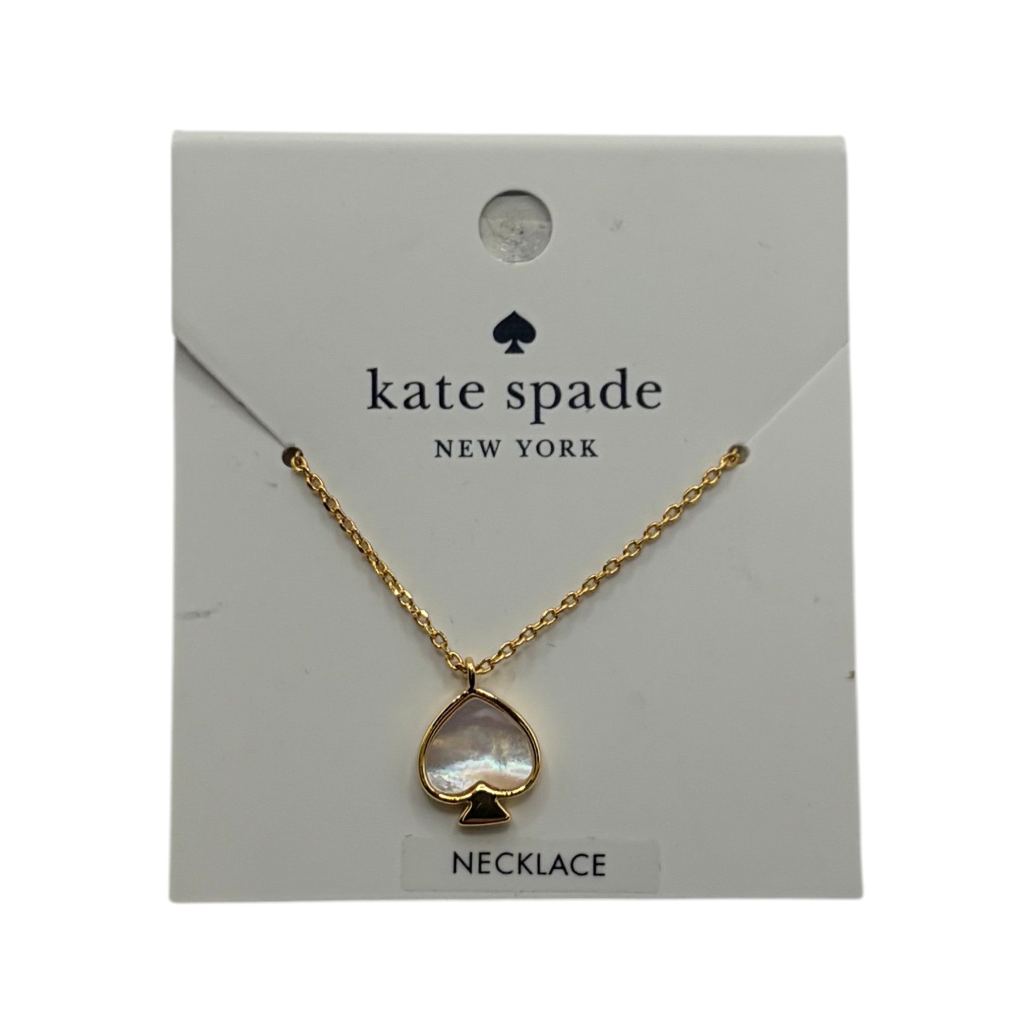 CURATED by Kira Kate Spade New York gold spade pendant necklace with iridescent mother of pearl inlay on display card