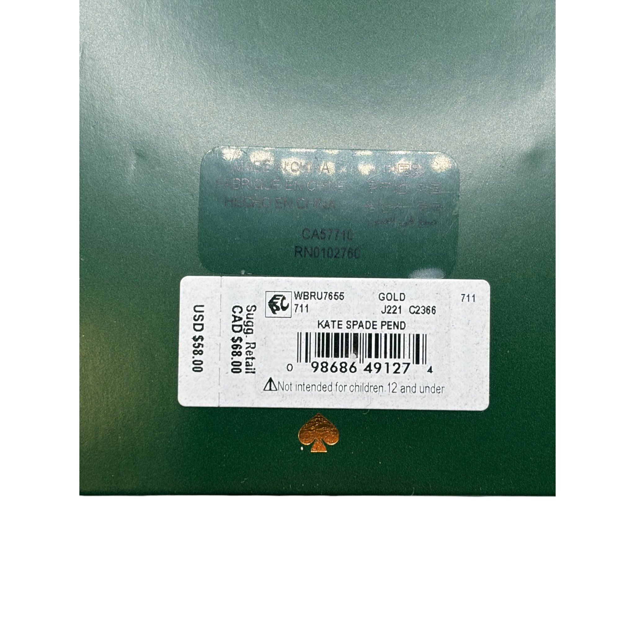CURATED by Kira Kate Spade New York gold initial M mini pendant product tag on green packaging