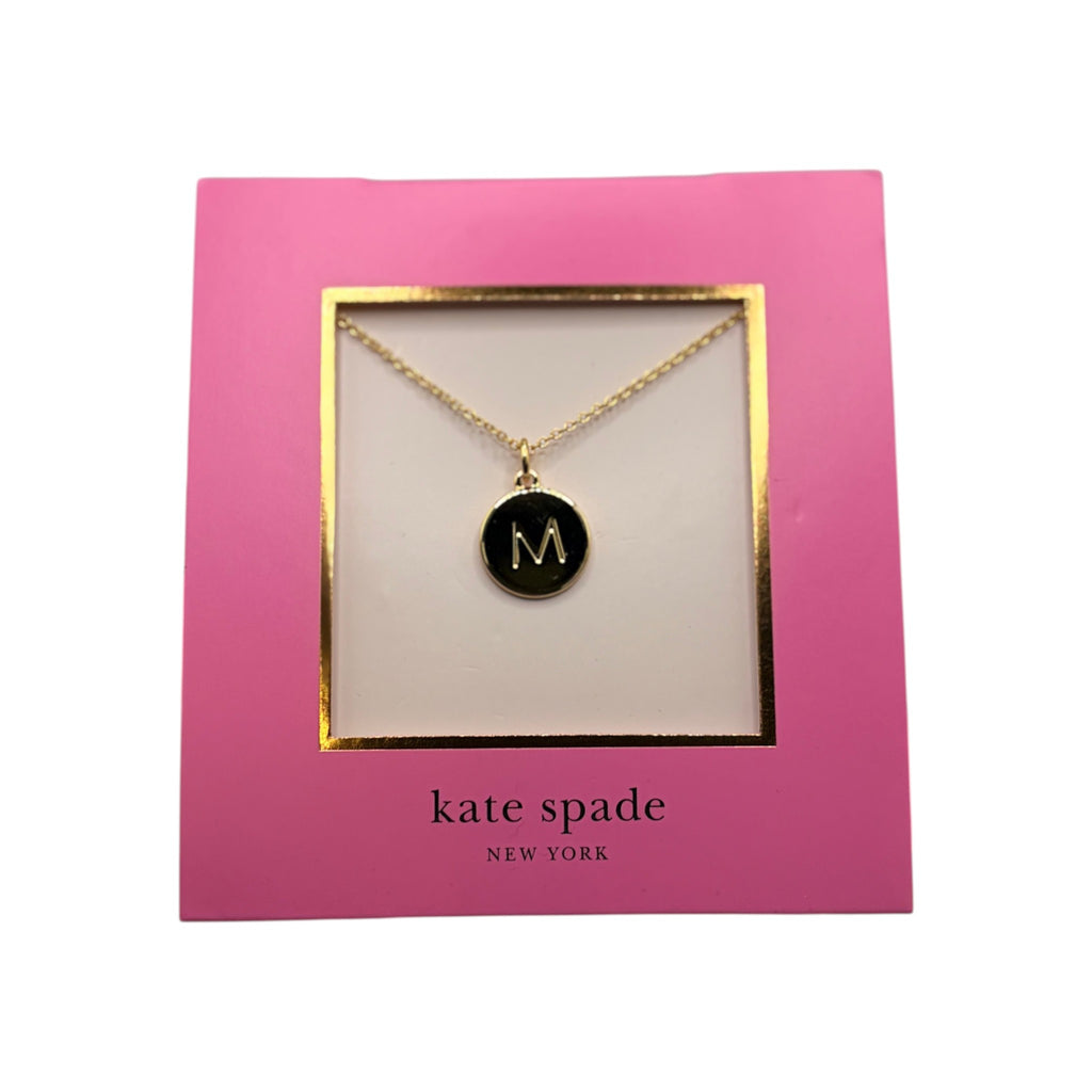 CURATED by Kira Kate Spade New York gold initial M mini pendant necklace on a pink display card