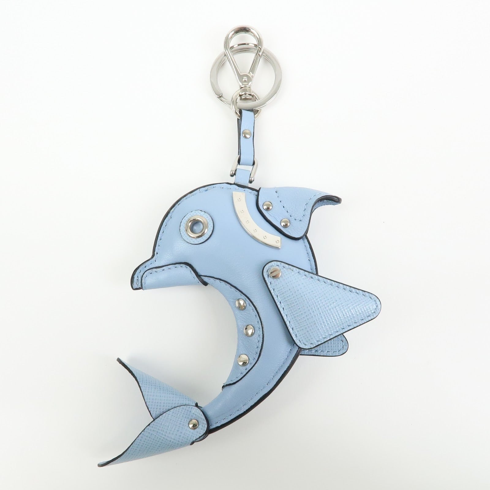 CURATED by Kira light blue Saffiano leather dolphin charm with silver hardware and Prada triangle logo.