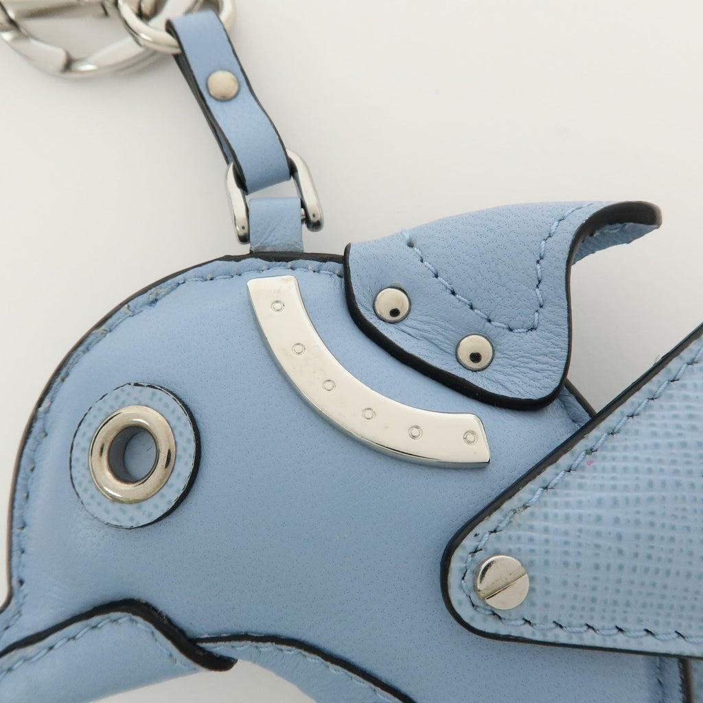 CURATED by Kira light blue leather dolphin charm with silver hardware and triangle logo