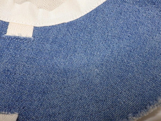 CURATED by Kira Loewe denim blue bucket hat with white interior lining and frayed edge detail