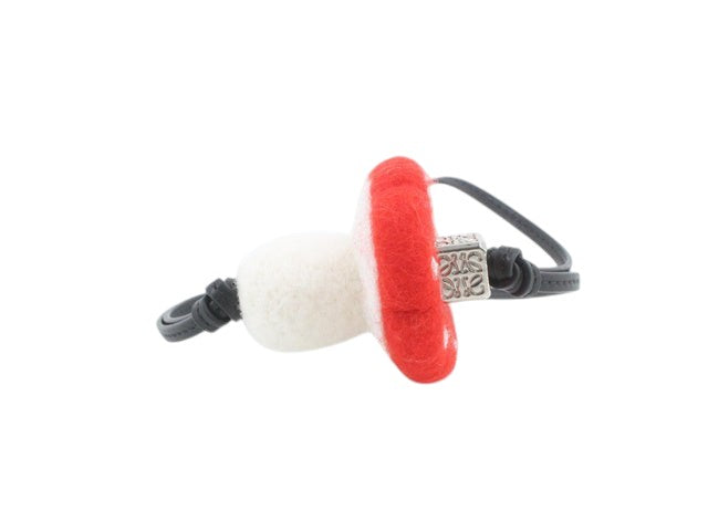 CURATED by Kira Loewe mushroom bag charm keychain in red and white felt with silver-tone hardware.